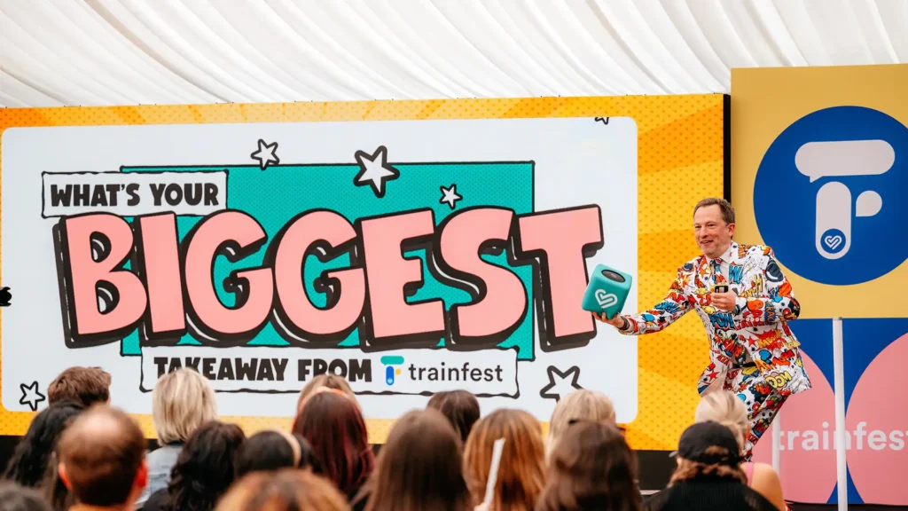 Event host on stage with content