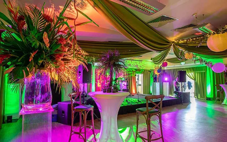 50th birthday stage set up indoors with decorations