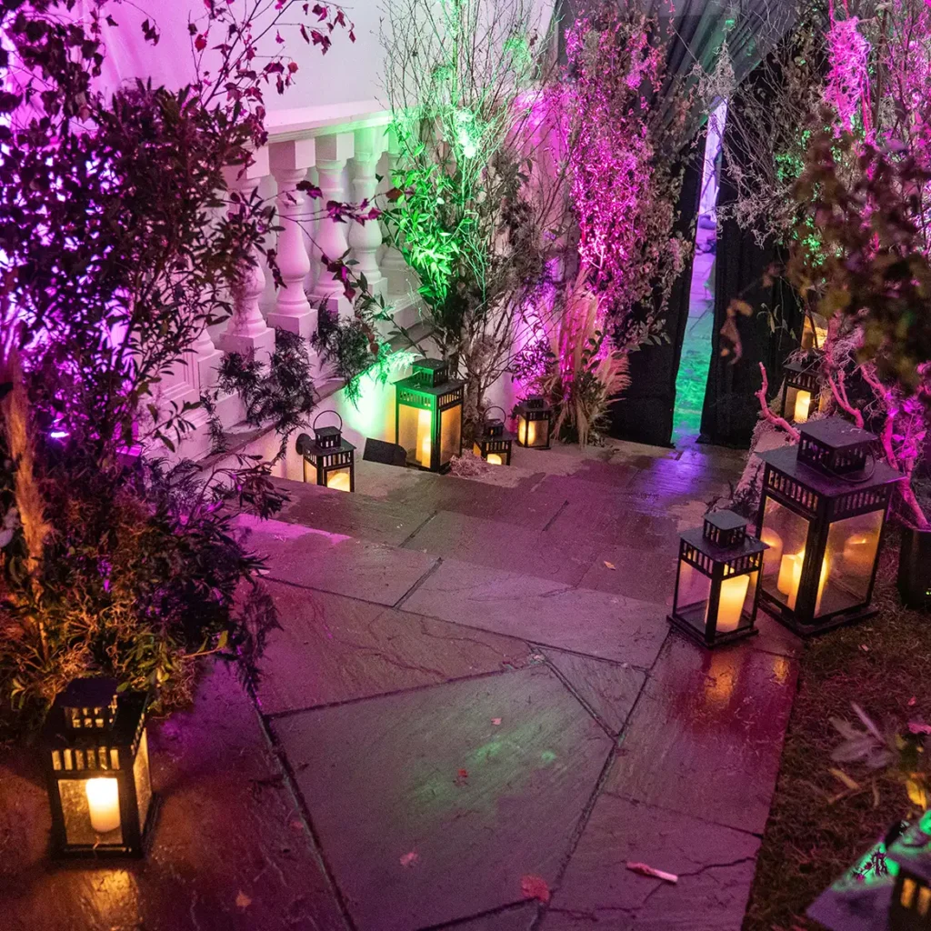 Exterior lighting scheme of purple, pink and green