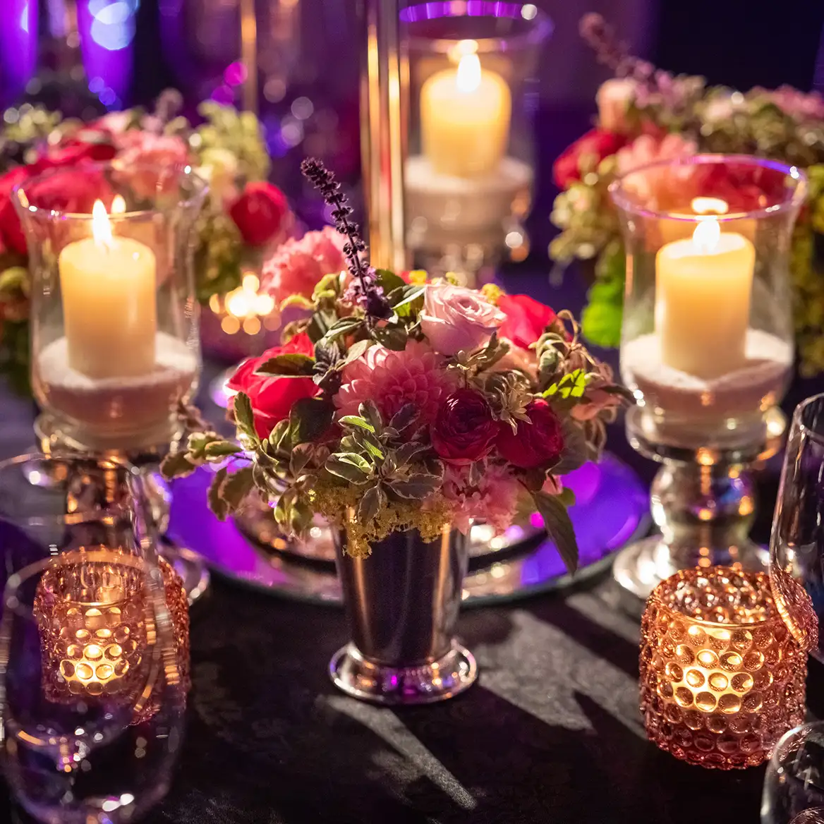 Florals and pillar candles on tables