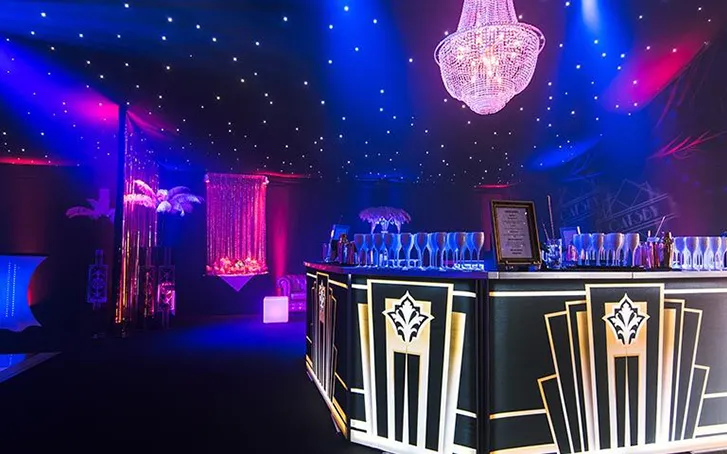 A bar with lighting at a milestone birthday celebration