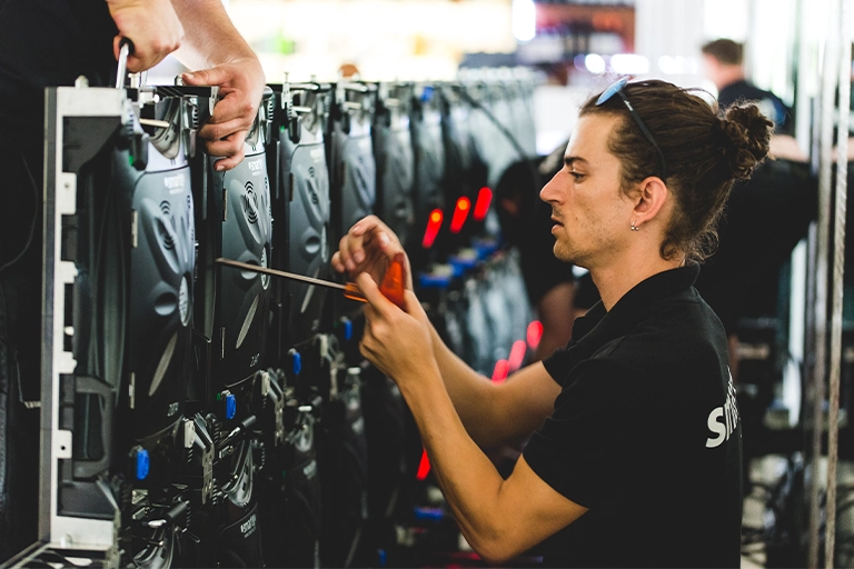 Event production technician setting up