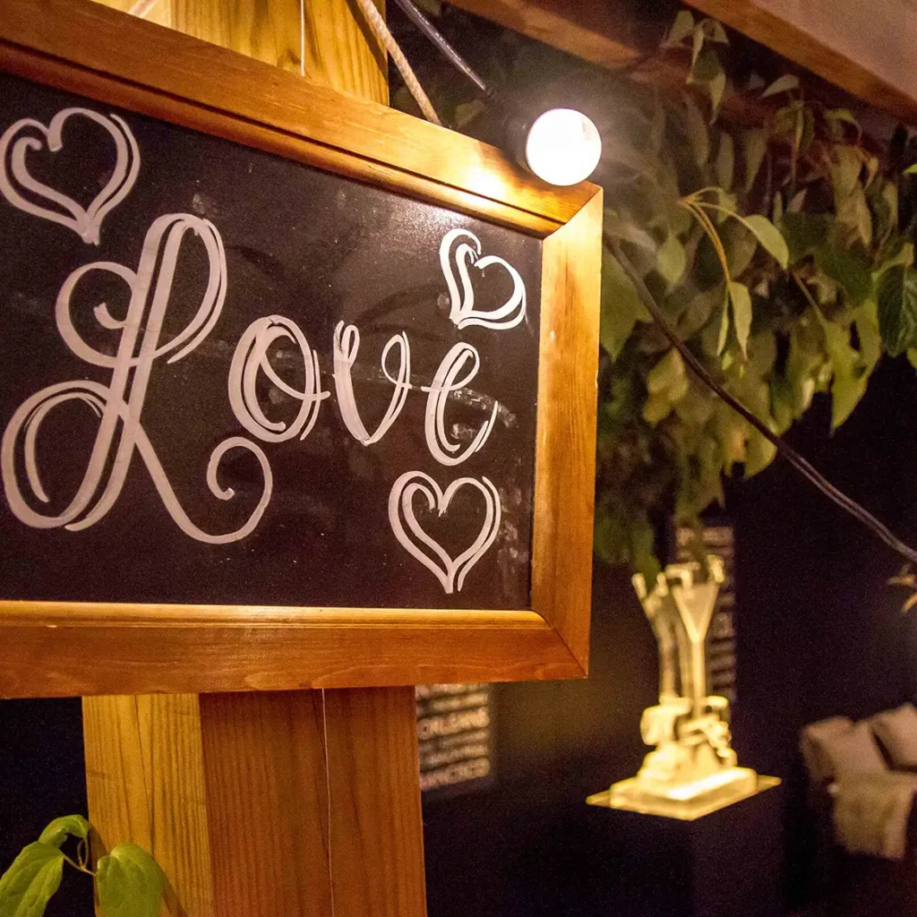 Love written on chalk board signage