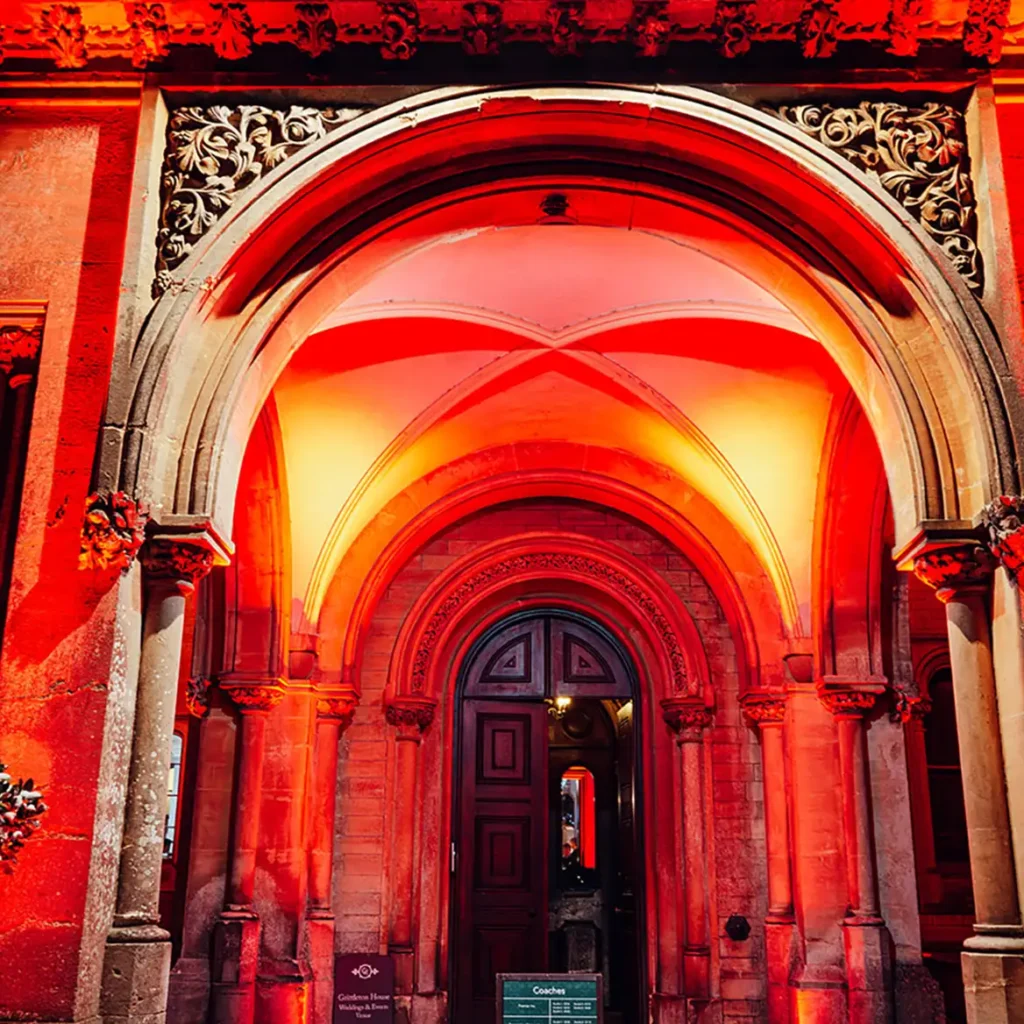 Hallway of venue in orange and green wash lights