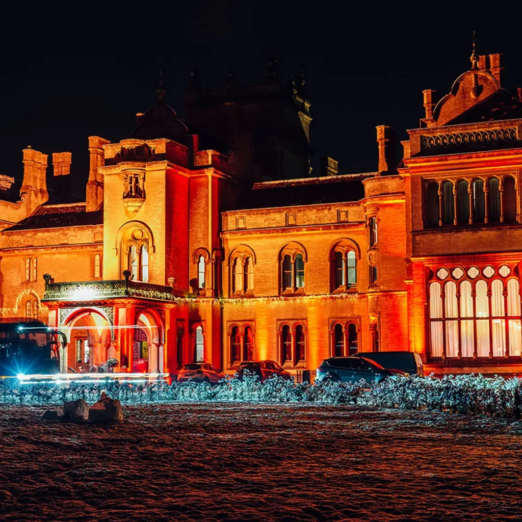 Grittleton House bathed in orange wash lights