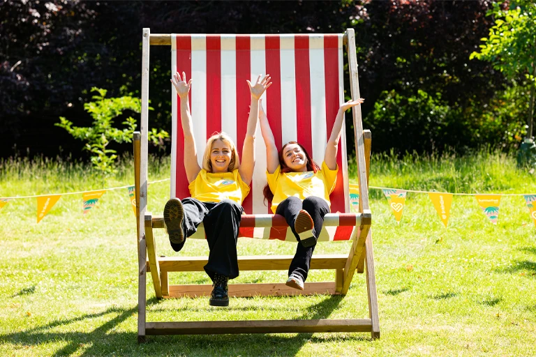 Two team in giant deck chair