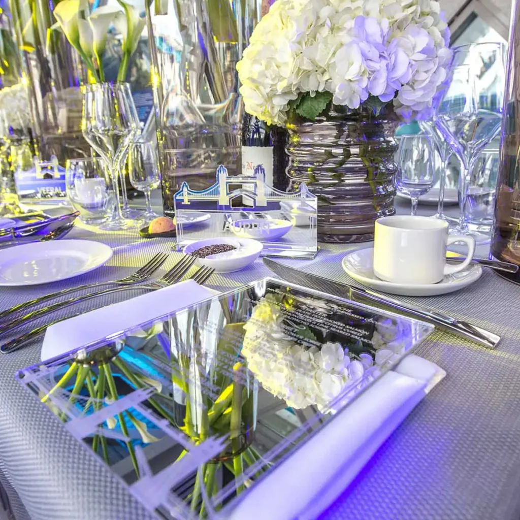 White florals, purple wash lights and mirrored menus
