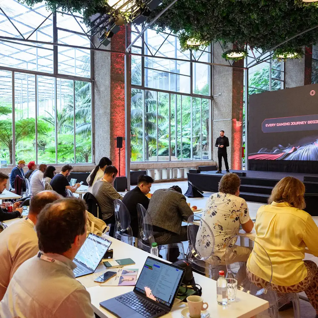 Stunning greenery backdrop to presenter on stage