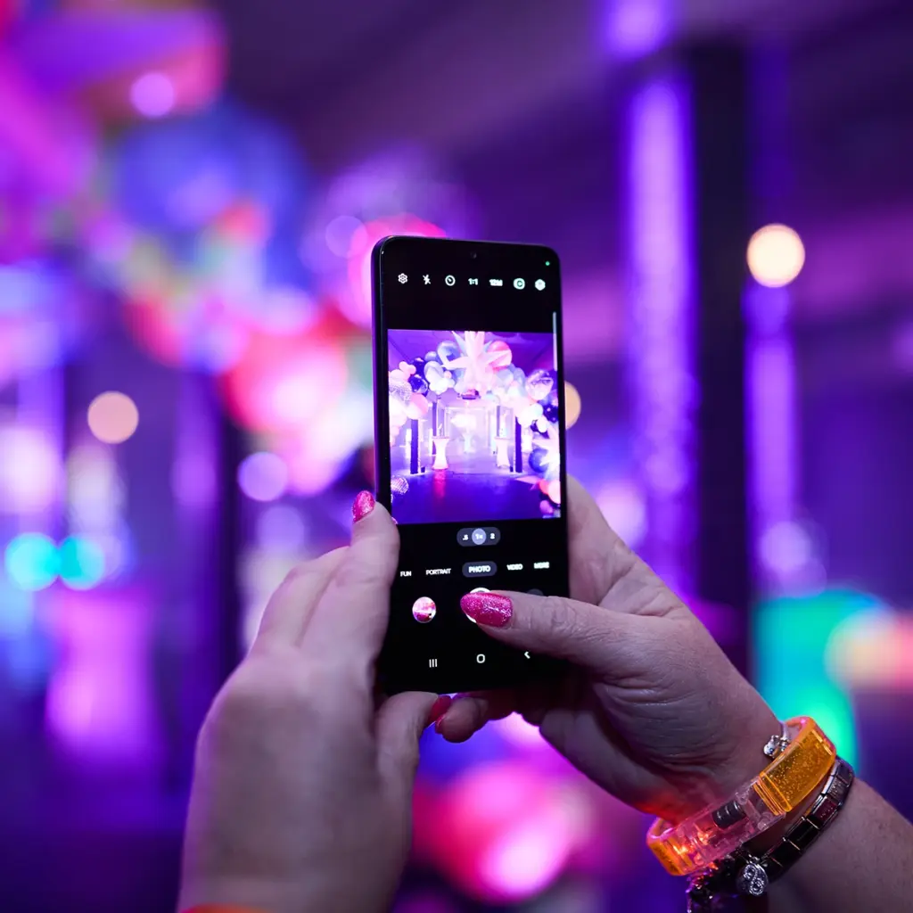Guests takes image of balloon arch