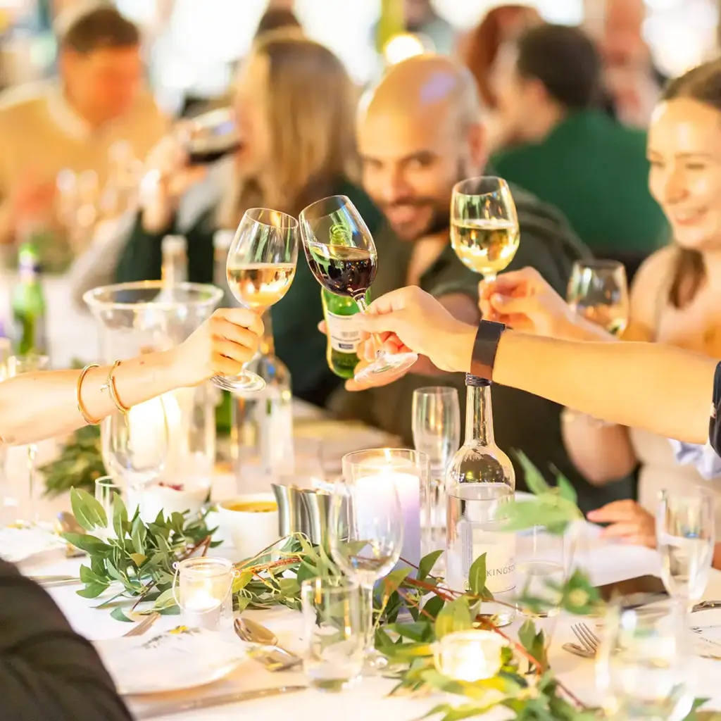 People toasting with wine glassess
