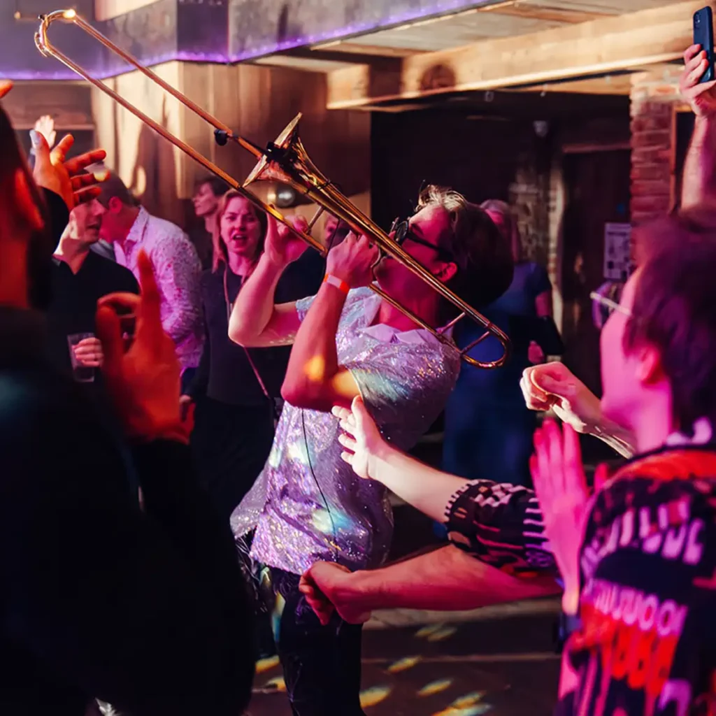 Saxophonist plays to party-goers