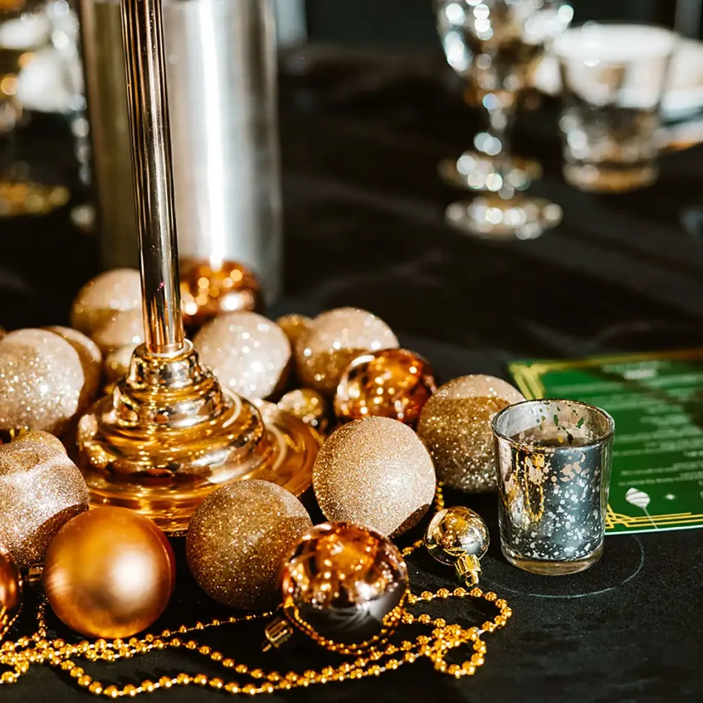 Golden baubles and tea lights for table decor