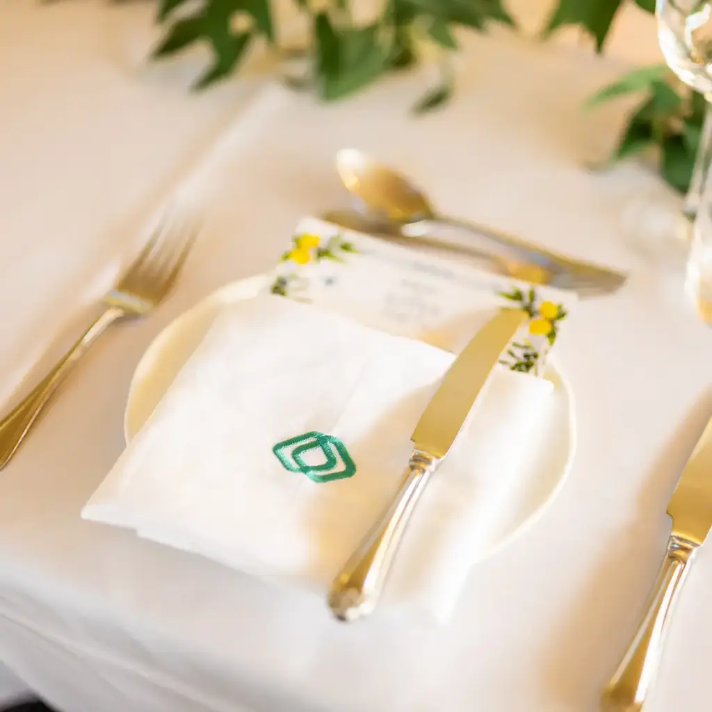 Brand napkin and menu for table setting at company event