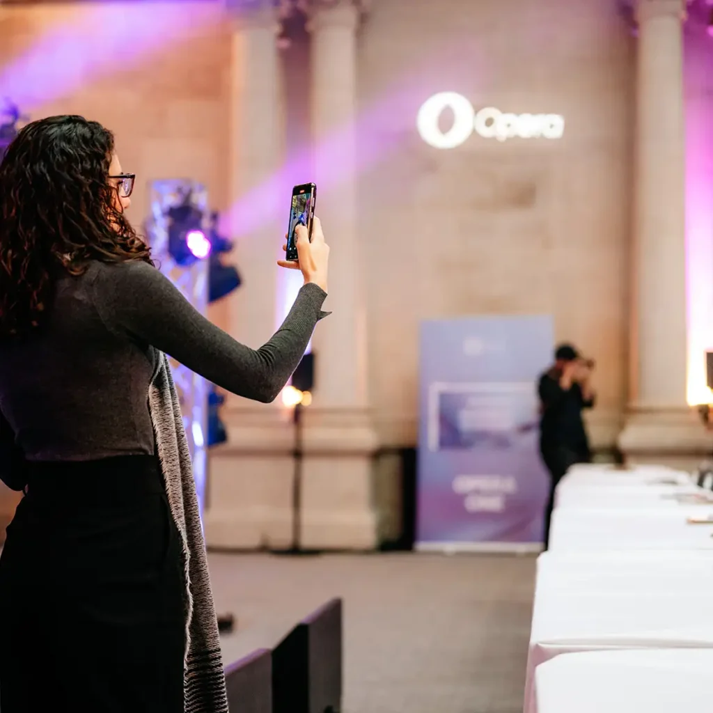 Journalist films opera projected logo