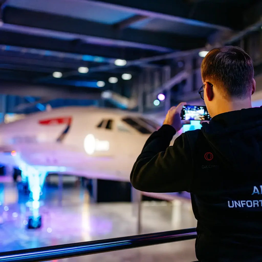 Guests takes a photo of Concorde on iPhone