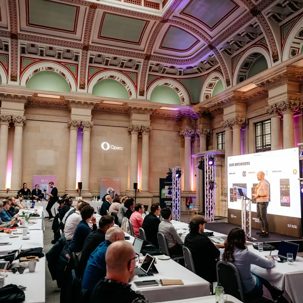 Presenter on stage with captive audience