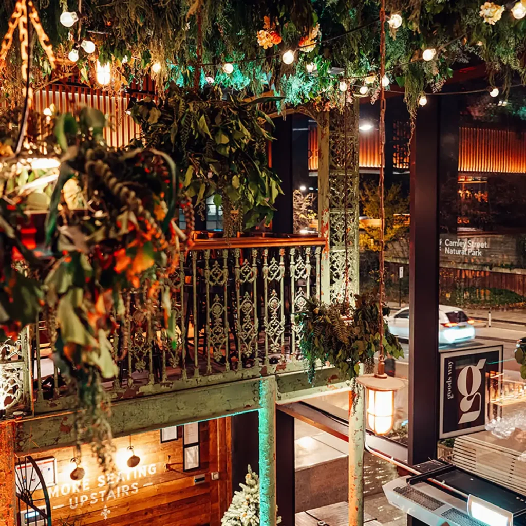 Green foliage and mistletoe in gallery of event space