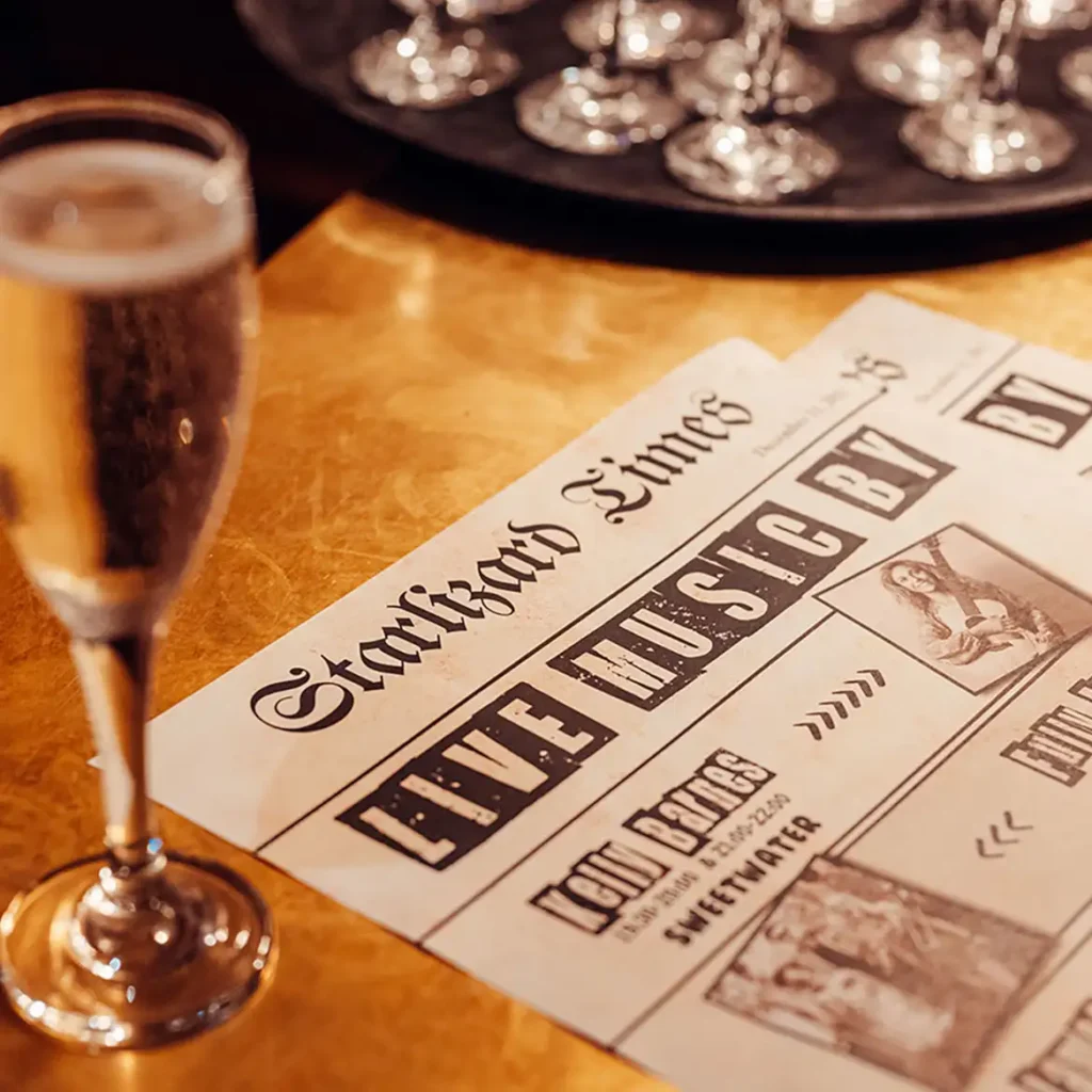 1920s style newspaper with champagne glass