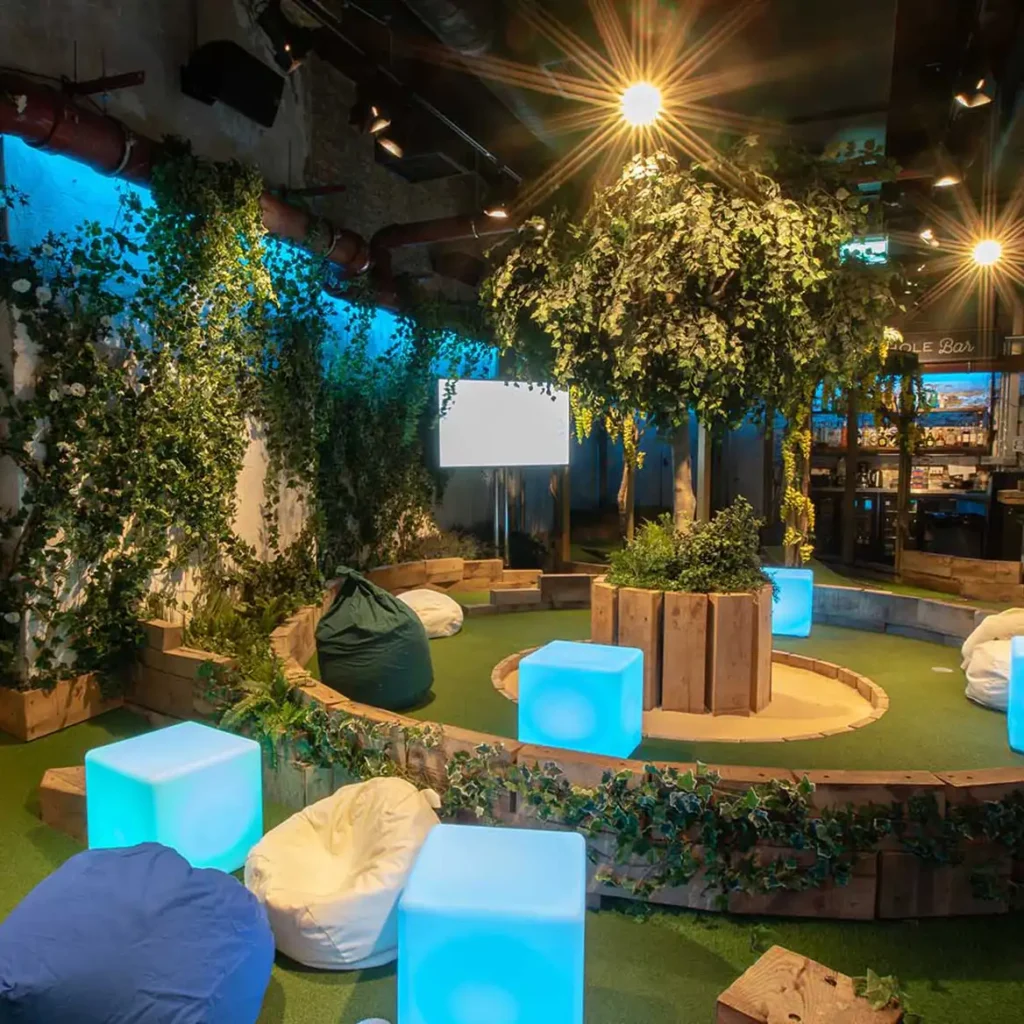 Green tress and foliage with LED cube furniture and beanbags