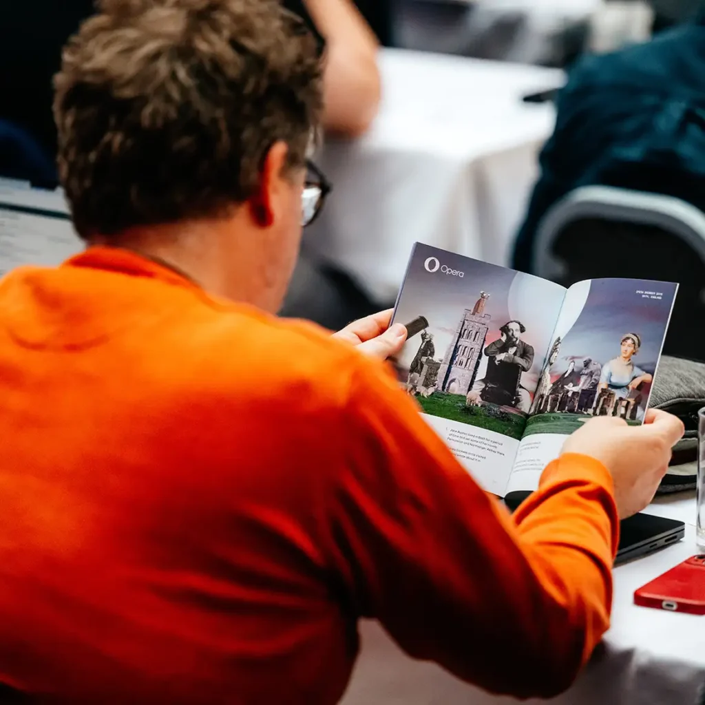 Man reads branded booklet