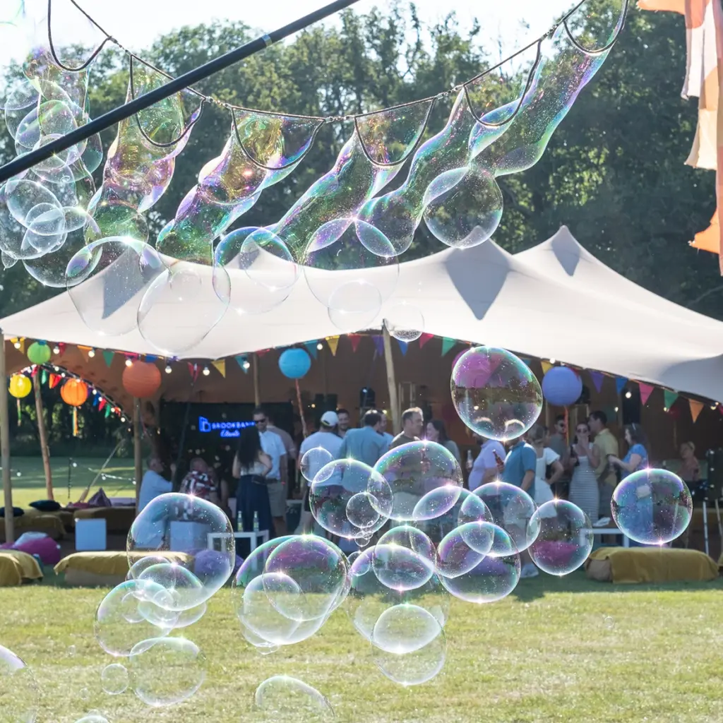Bubbles in front of stretch tent for corporate festival party