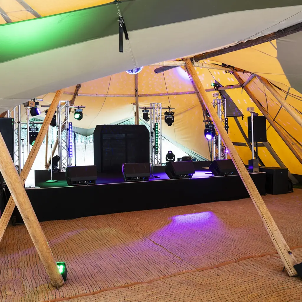 Bespoke built stage in marquee with stunning lighting