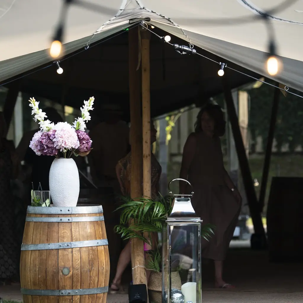 Floral arrangements outside of marquee