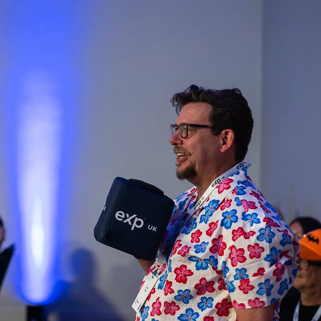 Audience member using catch box mic at conference