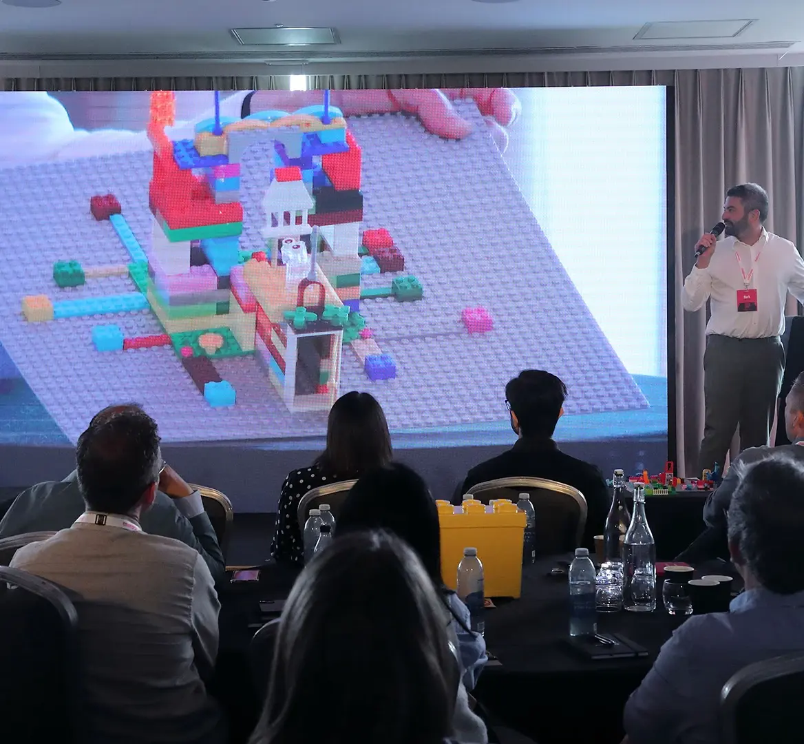 Why Delegates Expect More from Corporate Events in 2026 and How to Deliver It | MGN Events Stage at leadership team offsite for global brand